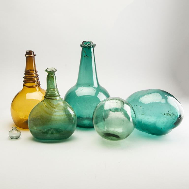 A group of five persian glass bottles and a ball, 19th/20th Century.