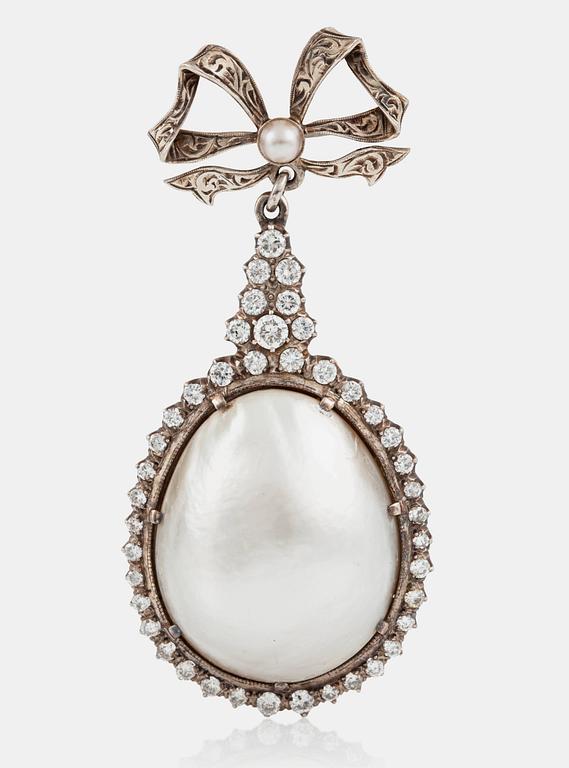 A large natural saltwater blister pearl and brilliant-cut diamond brooch. Diamond weight circa 1.50 cts in total.