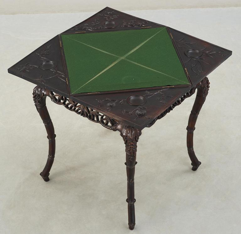 A hardwood games table, late Qing dynasty (1644-1912).