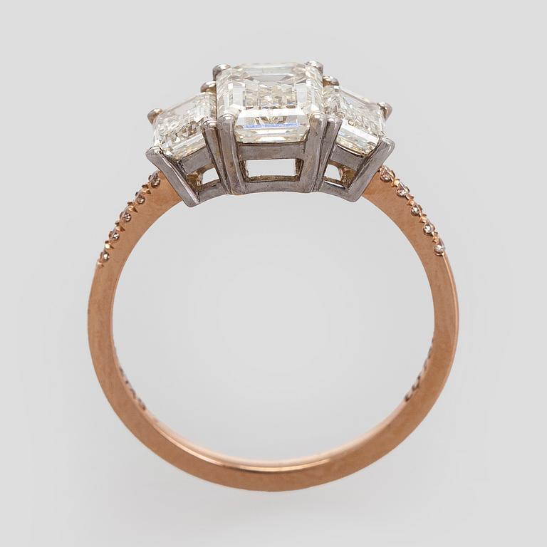 Ring, three baguette cut diamonds, small brilliant cut diamonds, 18K white gold and rose gold.