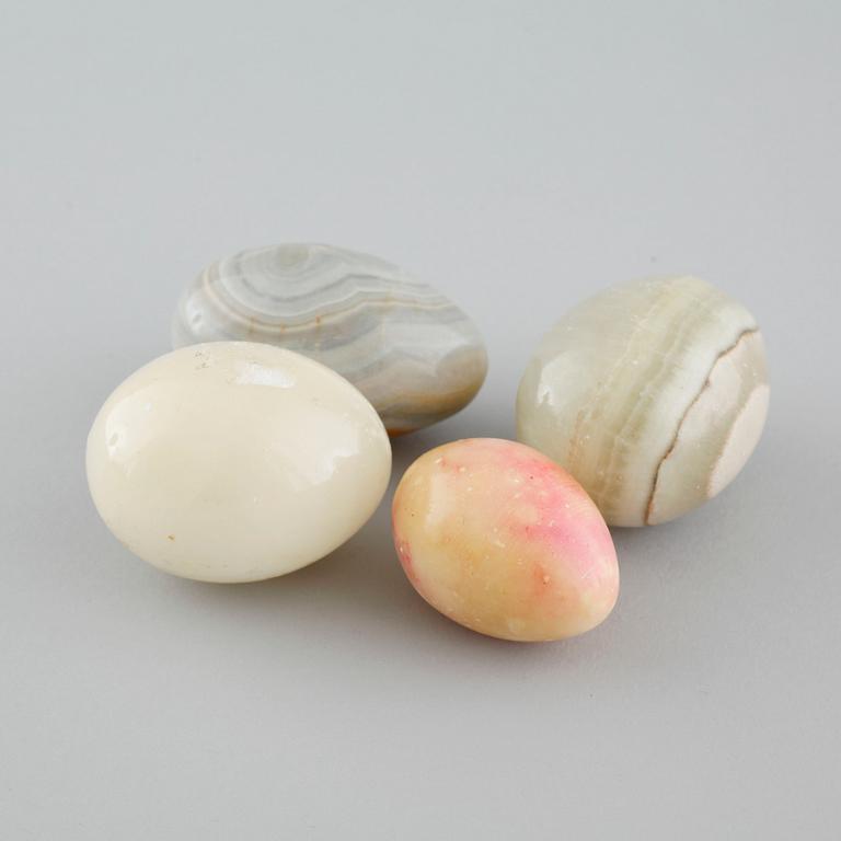 24 decorative eggs, some of alabaster, 20th century.