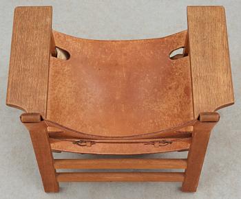 A Børge Mogensen oak and leather 'Spanish Chair' by Fredericia Stolefabrik, Denmark.