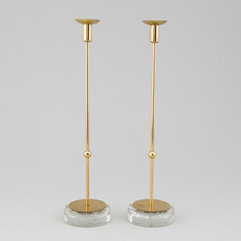 GUNNAR ANDER, A pair of Ystad metall brass candlesticks.