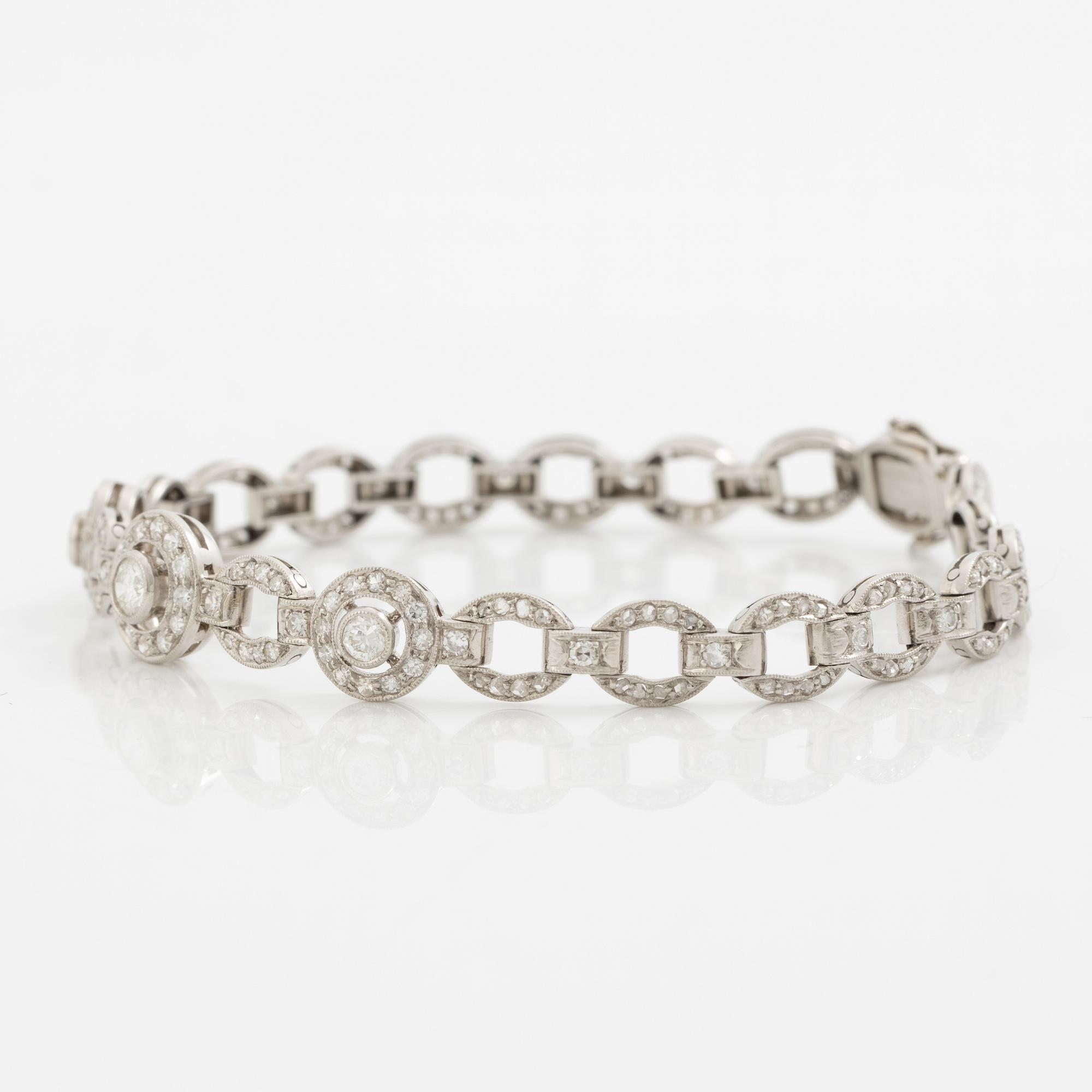 Bracelet in platinum set with round brilliant, octagonal, and rose-cut diamonds.