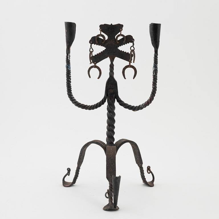 A Seedish wrought-iron three-light candlestick, circa 1900.