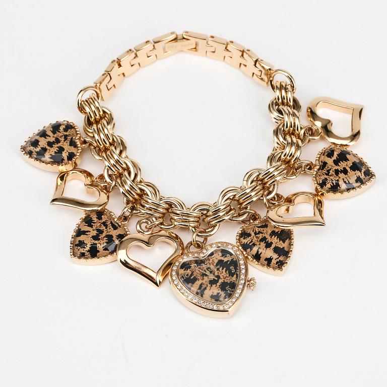 BETSEY JOHNSON, a golden bracelet with pendants and a watch.