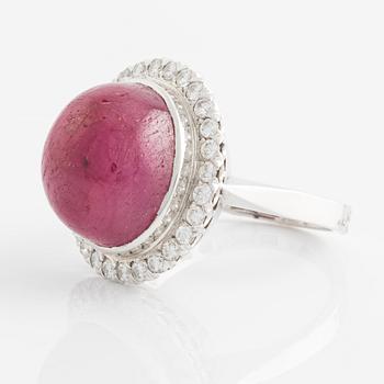 Ring, 18K white gold with cabochon-cut ruby and brilliant-cut diamonds.