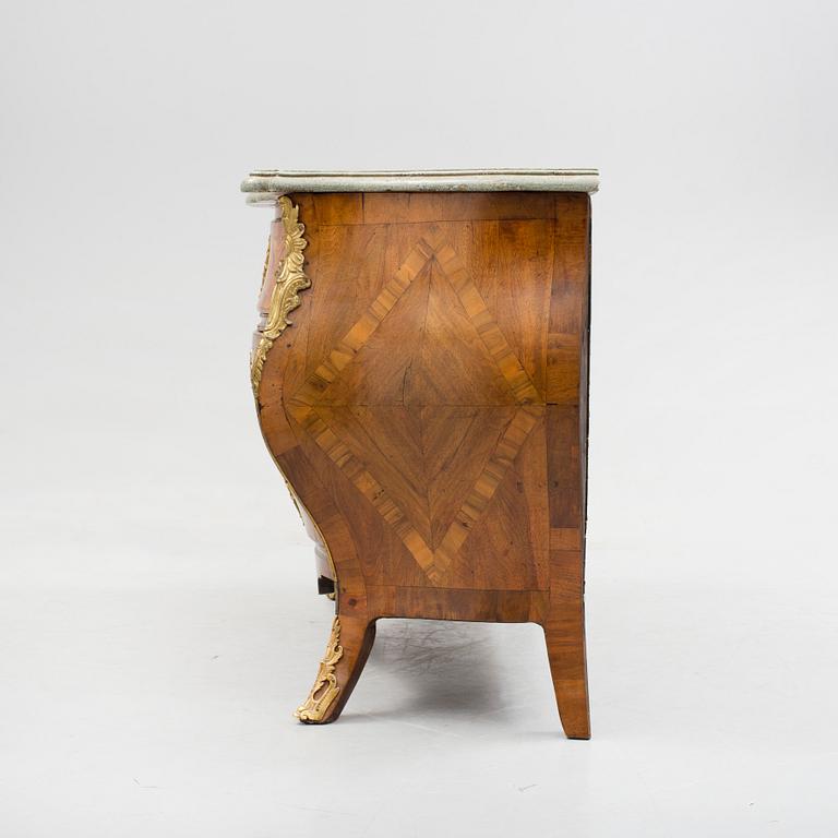 A 1700s rococo commode.