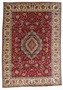 A Tabriz Carpet, circa 316 x 220 cm.