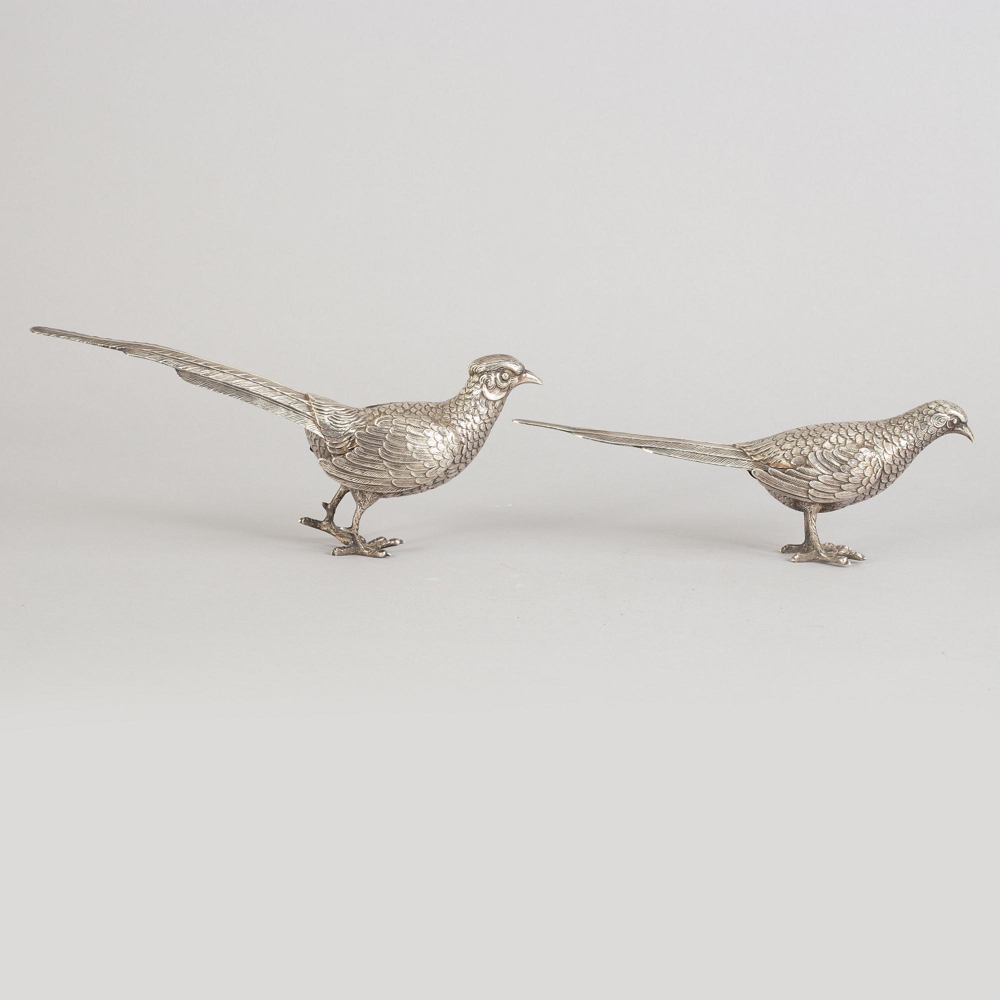 A pair of Spannish 20th century silver pheasants.
