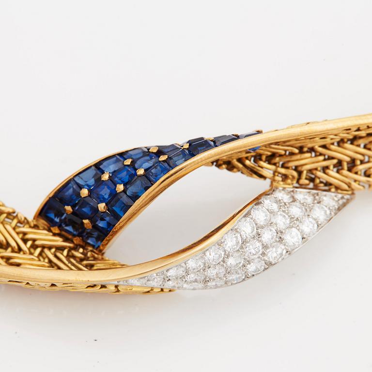 A necklace set with round- brilliant cut diamonds and step cut sapphires.