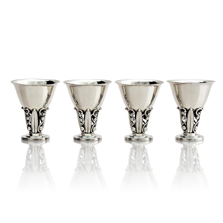 Evald Nielsen, four sterling silver beakers/cups on a foot, Denmark 20th century.
