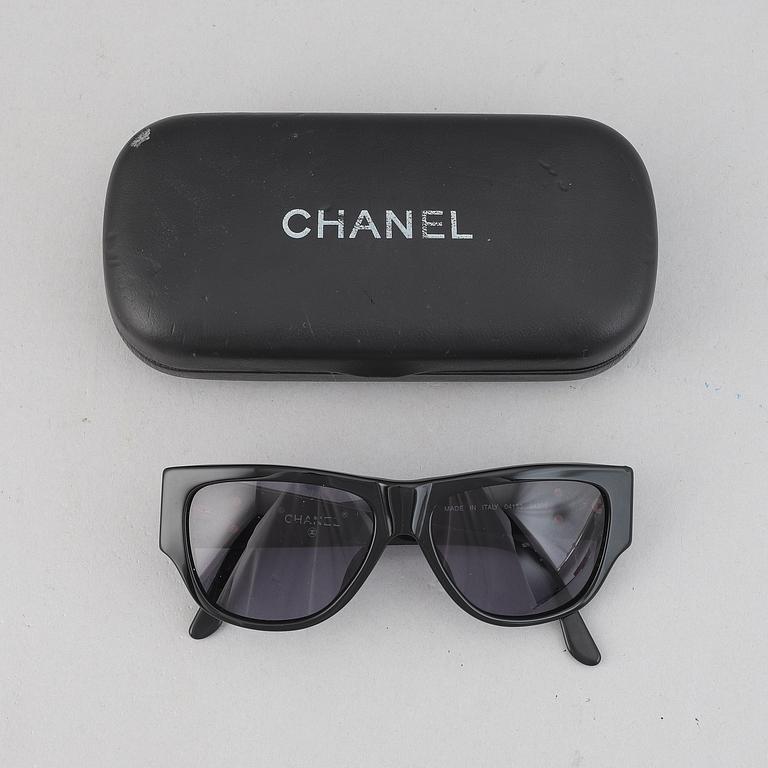 Chanel, a pair of sunglasses.