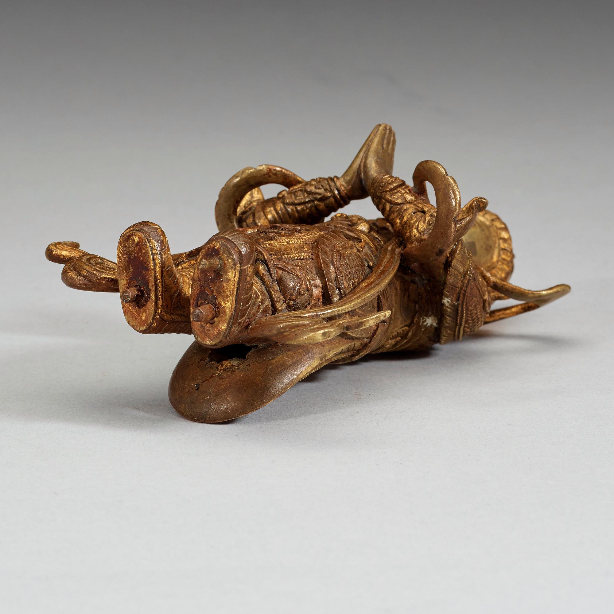 A gilt bronze figure of a Lokapala, Qing dynasty, 19th Century.