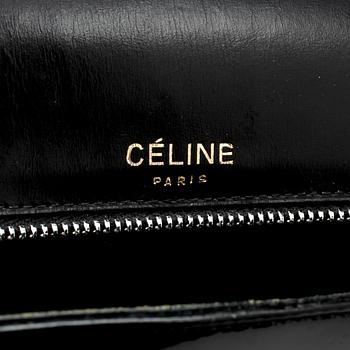 CÉLINE, a black leather patent shoulder bag.