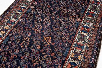 An oriental rug, c. 232 x 125 cm.