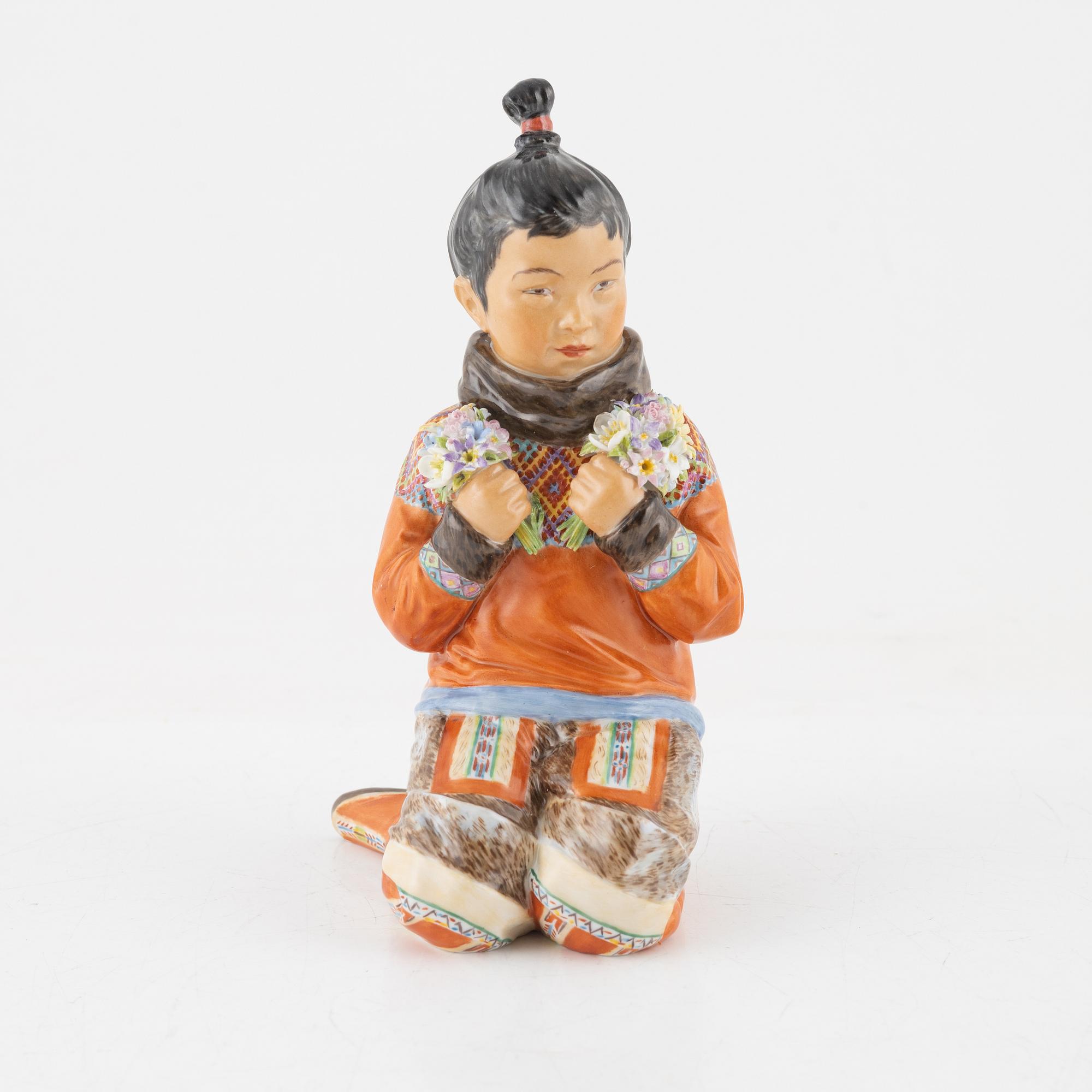 A Royal Copenhagen porcelain figure of an innuit from Grönland, Denmark, early 20th Century.