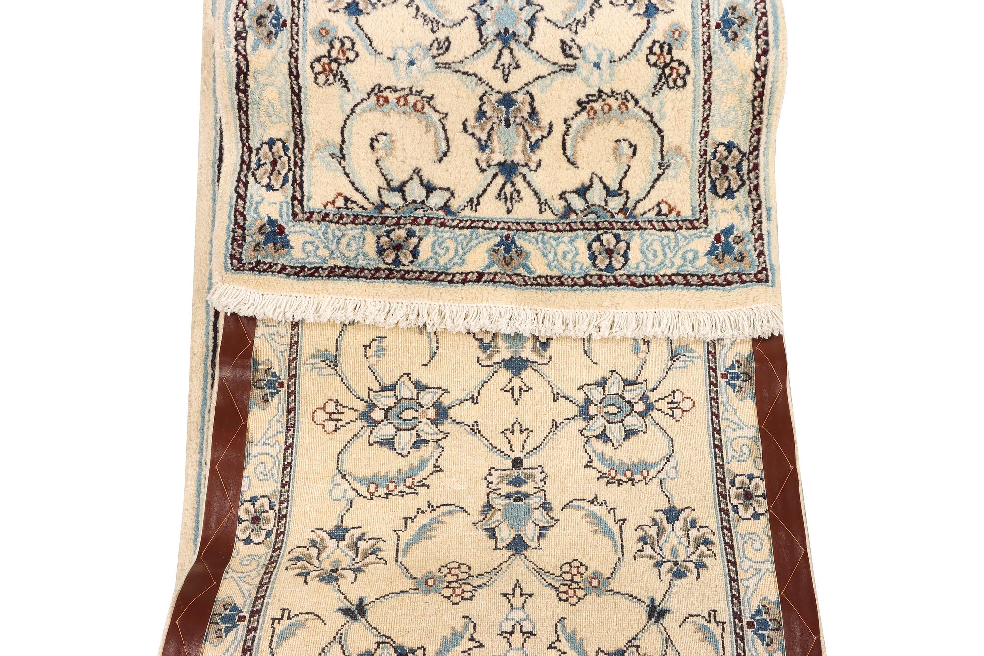 A Nain runner, part silk, c. 288 x 64 cm.
