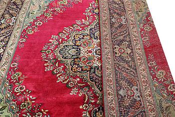 A Tabriz carpet, c. 330 x 250 cm.