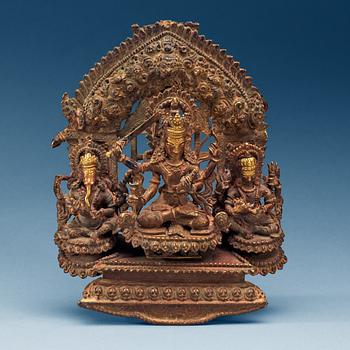 1526. A bronze figure of three seated deities, Nepal, 19th Century.