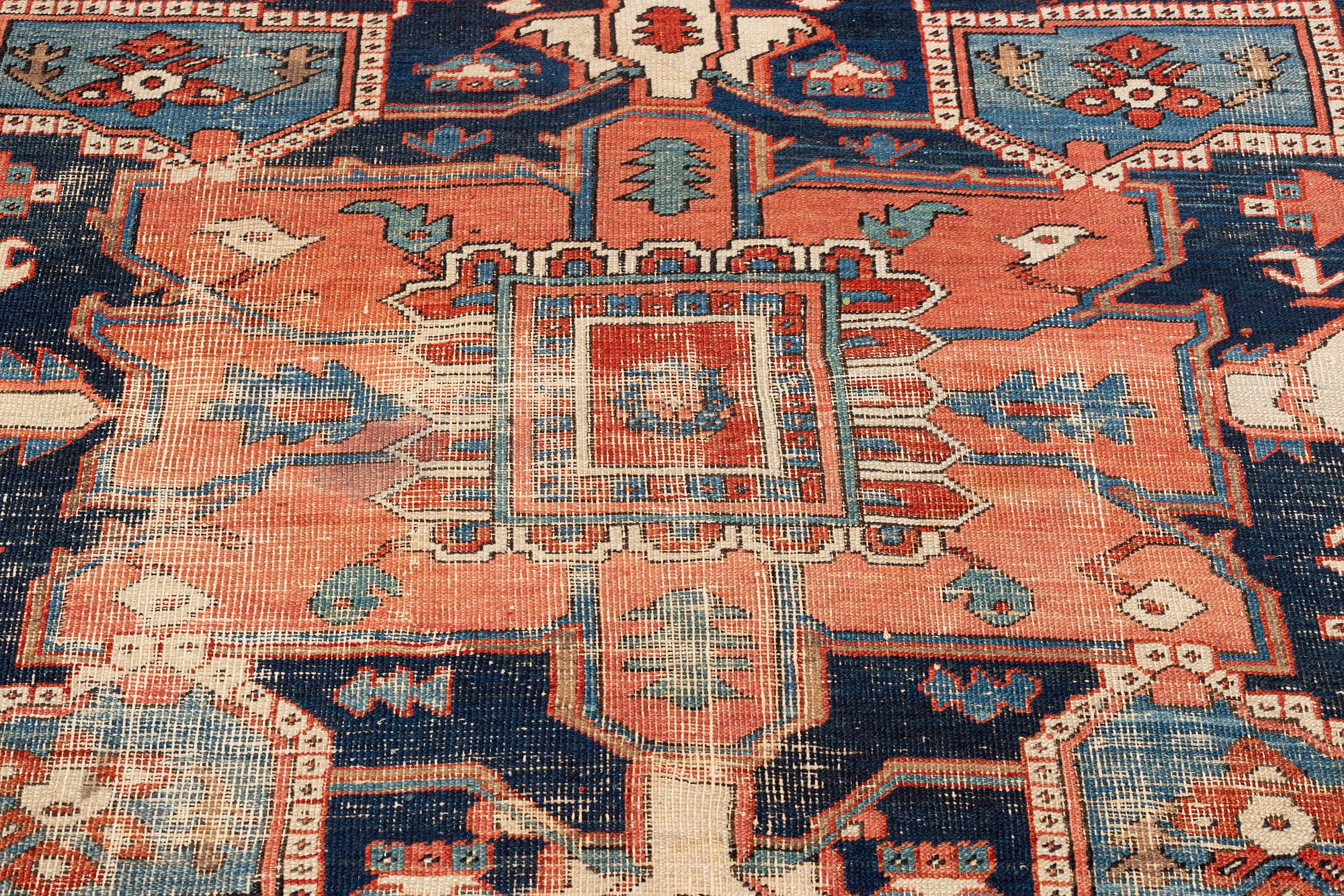 An antique Heriz carpet, ca 350 x 317 cm.