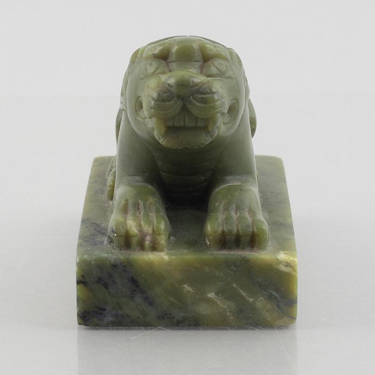 A Chinese stone figure of a lion, 20th century.