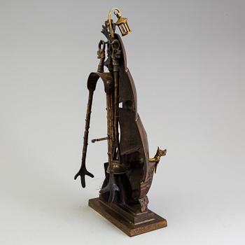 A set of three, early 20th century, bronze fire irons together with a stand, Nestor, England.