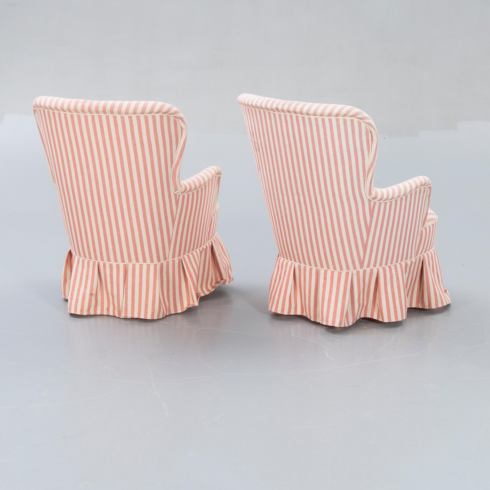 A pair of Modern easy chairs.
