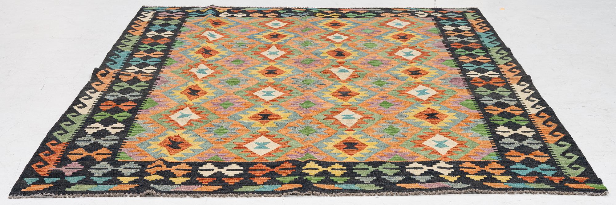 A kilim carpet, ca 251 x 188 cm.