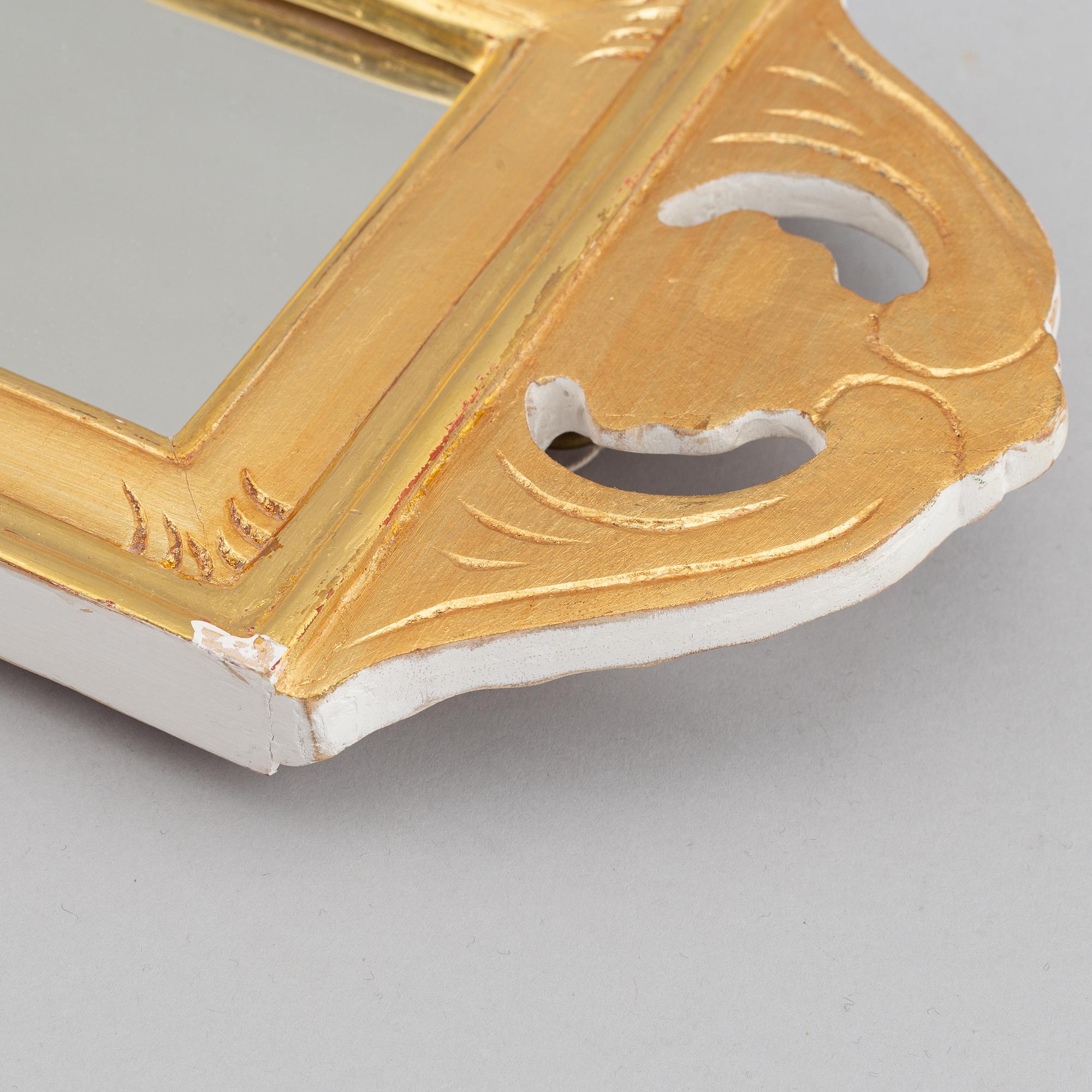 A 'Regnaholm' Gustavian style mirror sconce from Ikea, 1990.