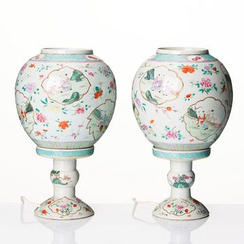 A pair of famille rose lanterns with stands, late Qing dynasty.