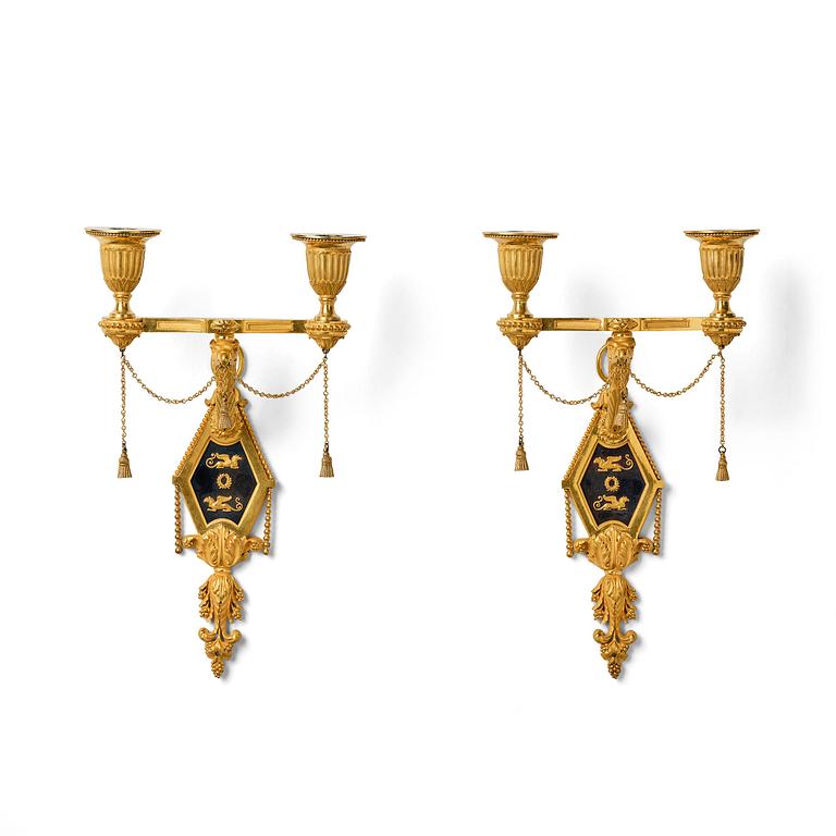 A pair of two-branch late Louis XVI ormolu and blued steel appliques attr. to F. Rémond (bronzier in Paris 1774-1812).