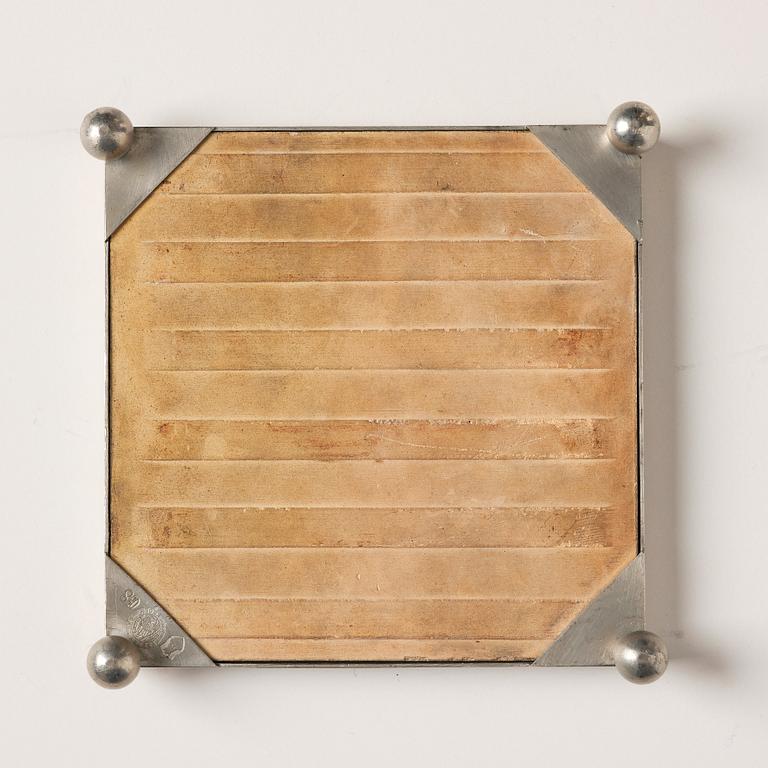 Firma Svenskt Tenn, a pewter framed ceramic tile placemat, Stockholm 1931.