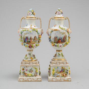 A pair of 19th century lidded vases, porcelain, Germany.