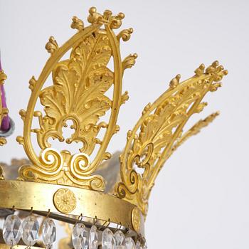 An French Empire eight-light gilt-brass and cut-glass chandelier.