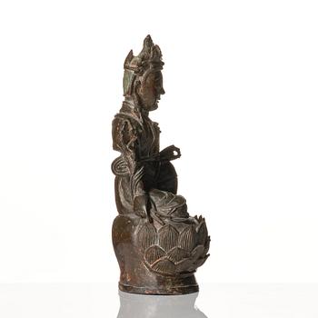 A bronze figure of Guanyin, late Ming dynasty (1368-1644).