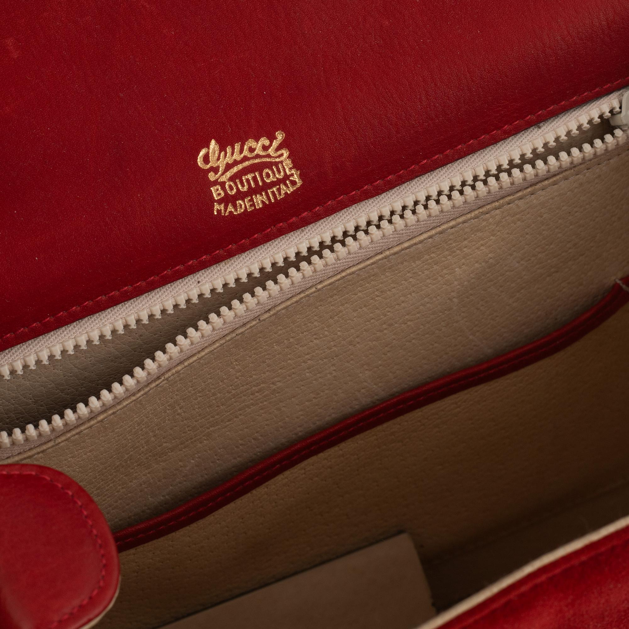 Gucci, a vintage suede bag.