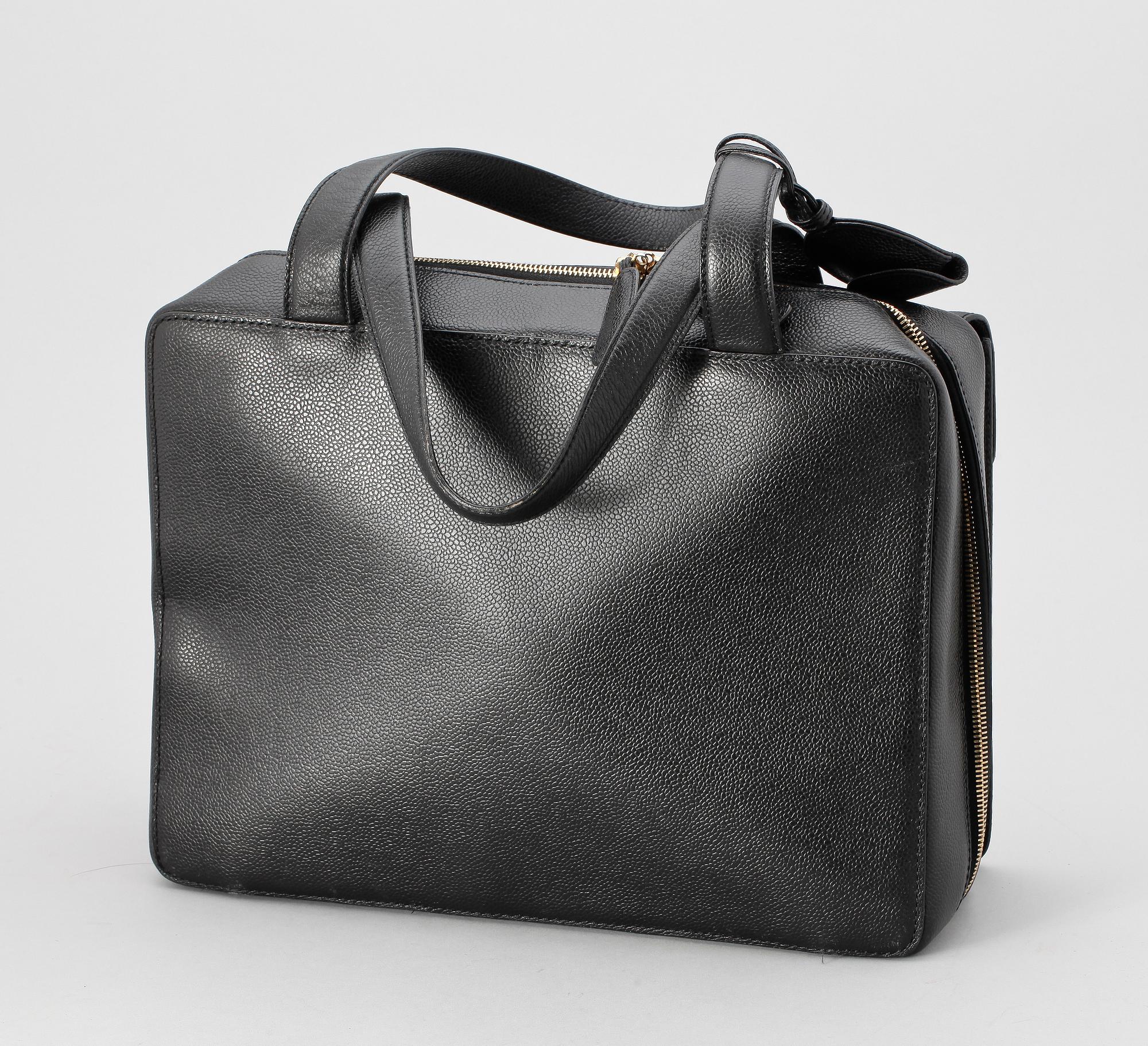A 21th cent black "caviar" leather beautybox/weekendbag by Chanel.