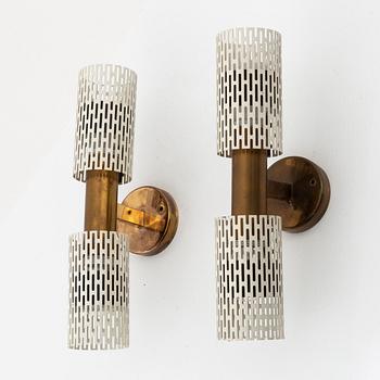 A pair of model 11262 wall lamps by Harald Notini for Böhlmarks, 1940s/50s.