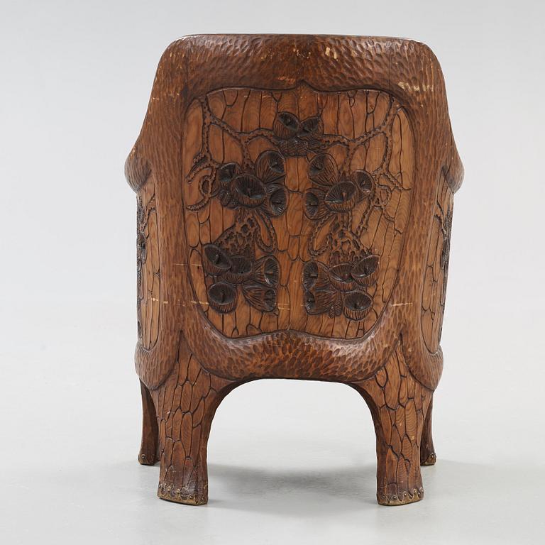 A Gustaf Fjaestad Art Nouveau carved pine chair, 'Stabbestol', by Adolf Swanson, Arvika, Sweden 1908.