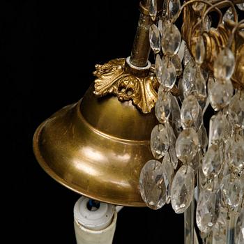 An Oscarian gilt brass eight-light chandelier.
