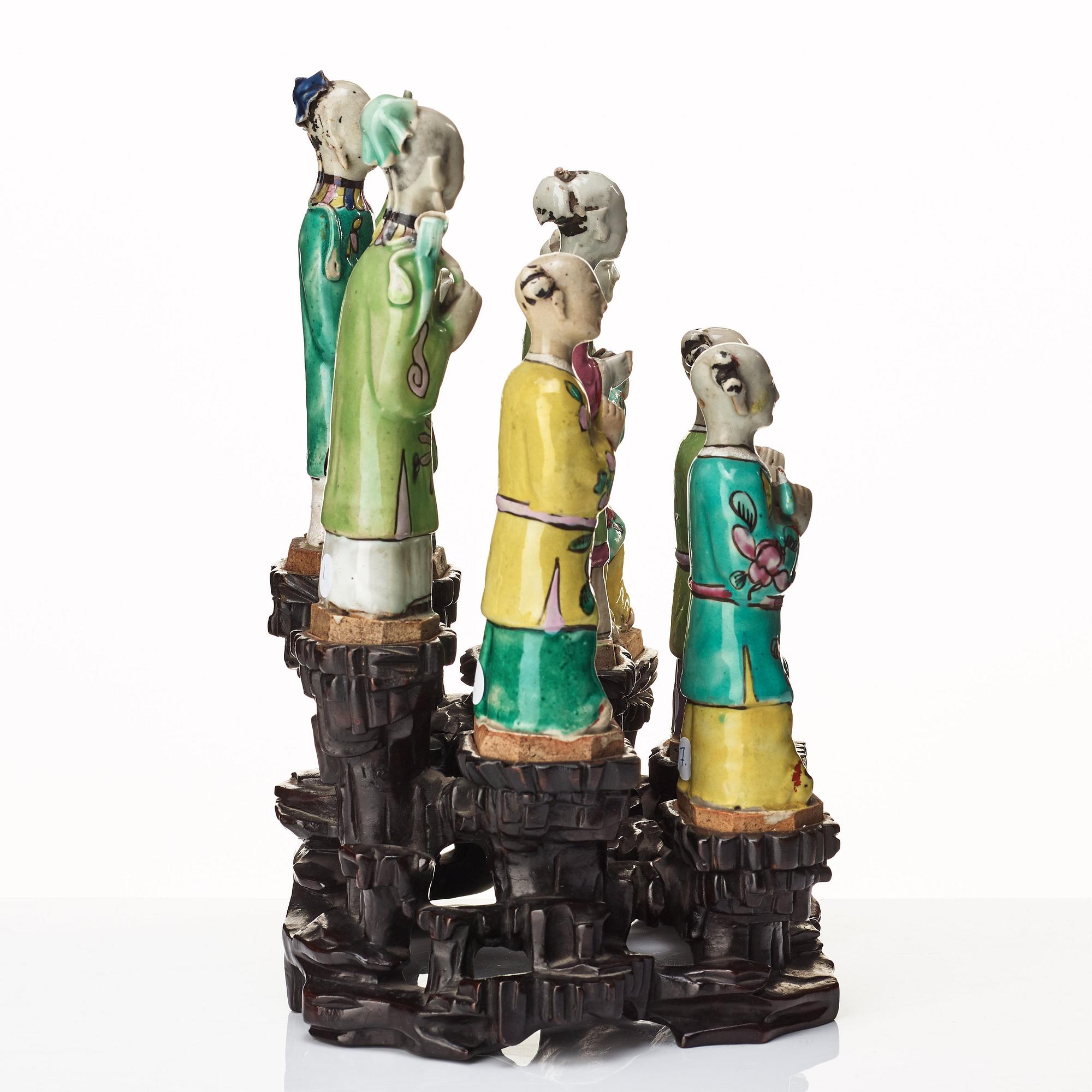 A group of eight immortals on  wooden stand, Qing dynasty, 19th Century.