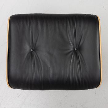 Charles & Ray Eames, Armchair with ottoman, "Lounge chair", Vitra, 21st century.