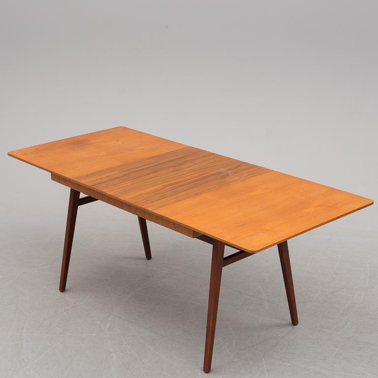 A teak veneered dining table, 1950's/60's.