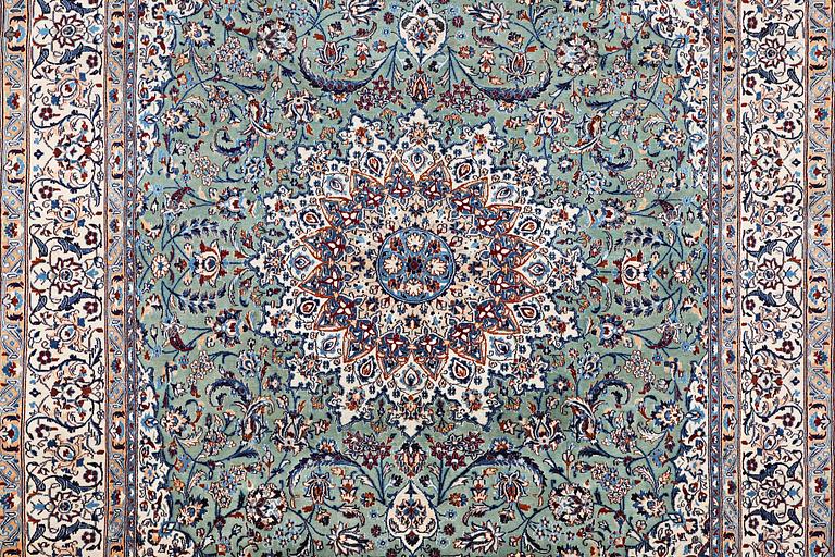 A carpet, Nain, part silk, 9 laa, circa 383 x 294 cm.
