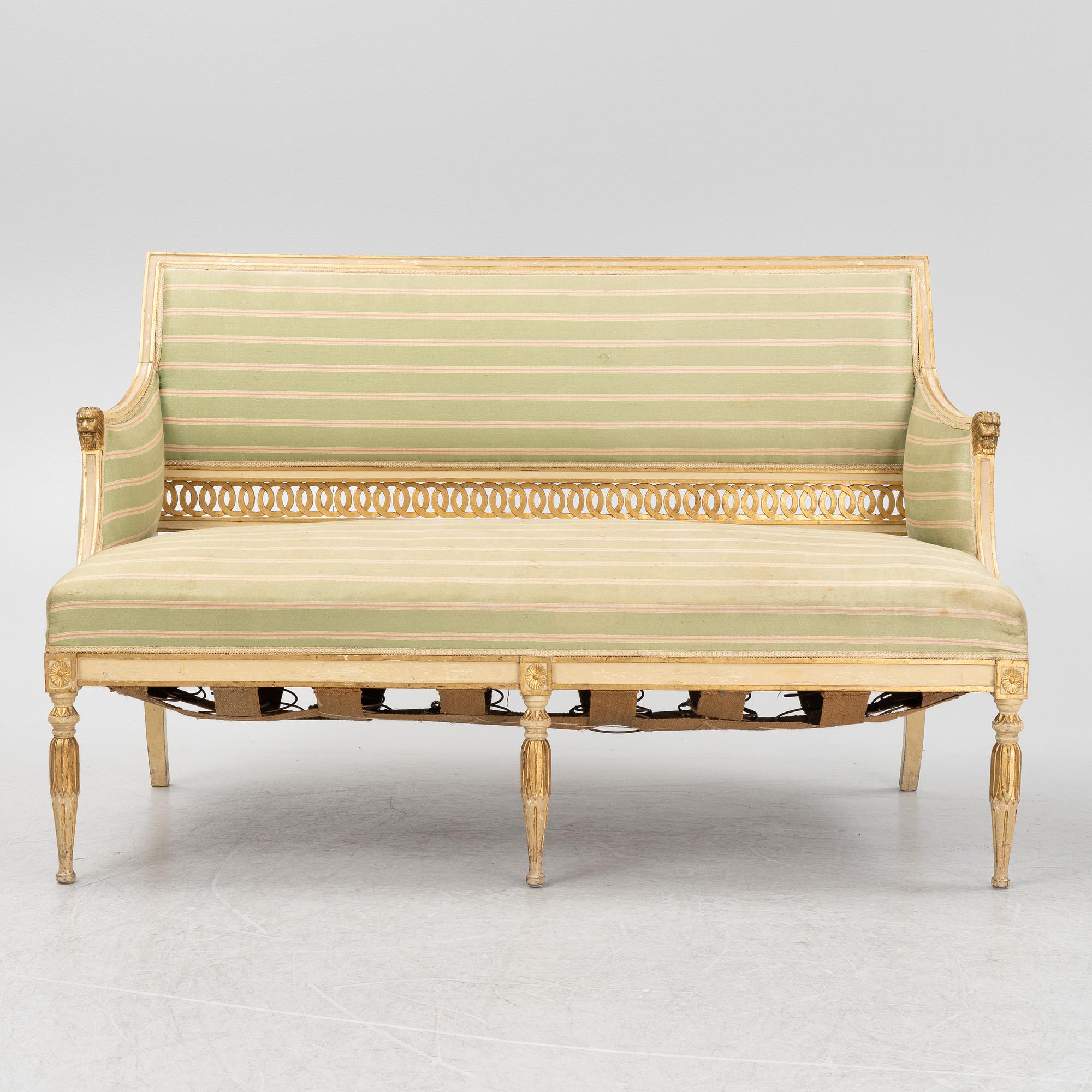 A late Gustaivan style sofa and four matched chairs from around the year 1900.