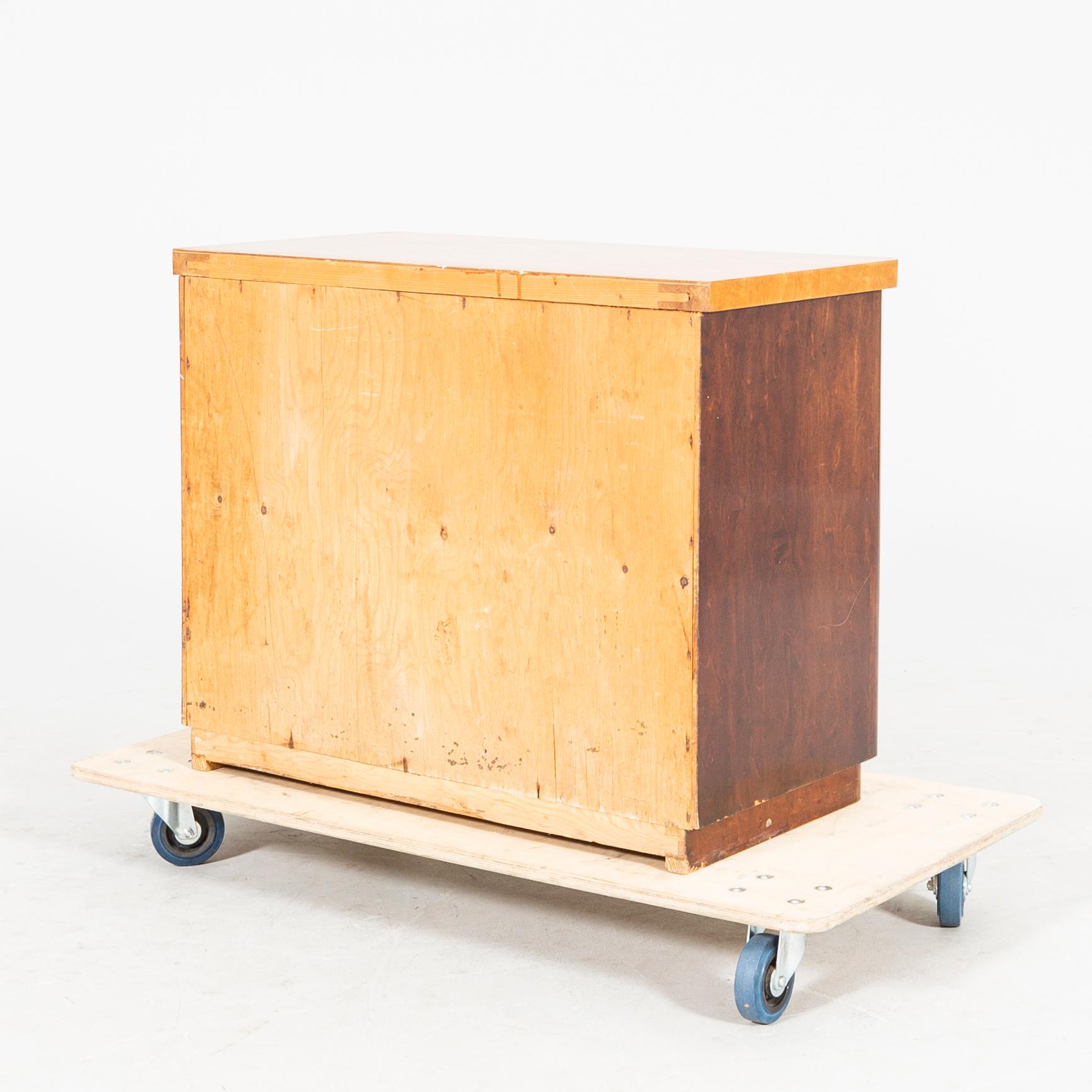 A 1940s Art Deco birch dresser.