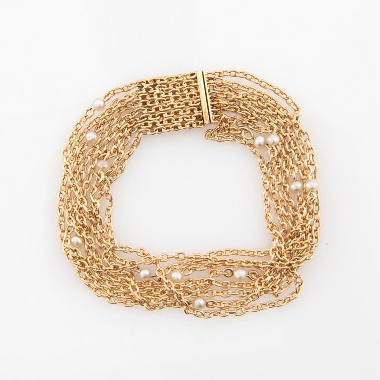 Bracelet 18K gold and seed pearls.