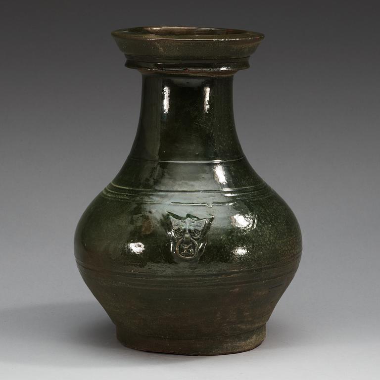 A green glazed jar, Han dynasty (206 BC - 220 AD).