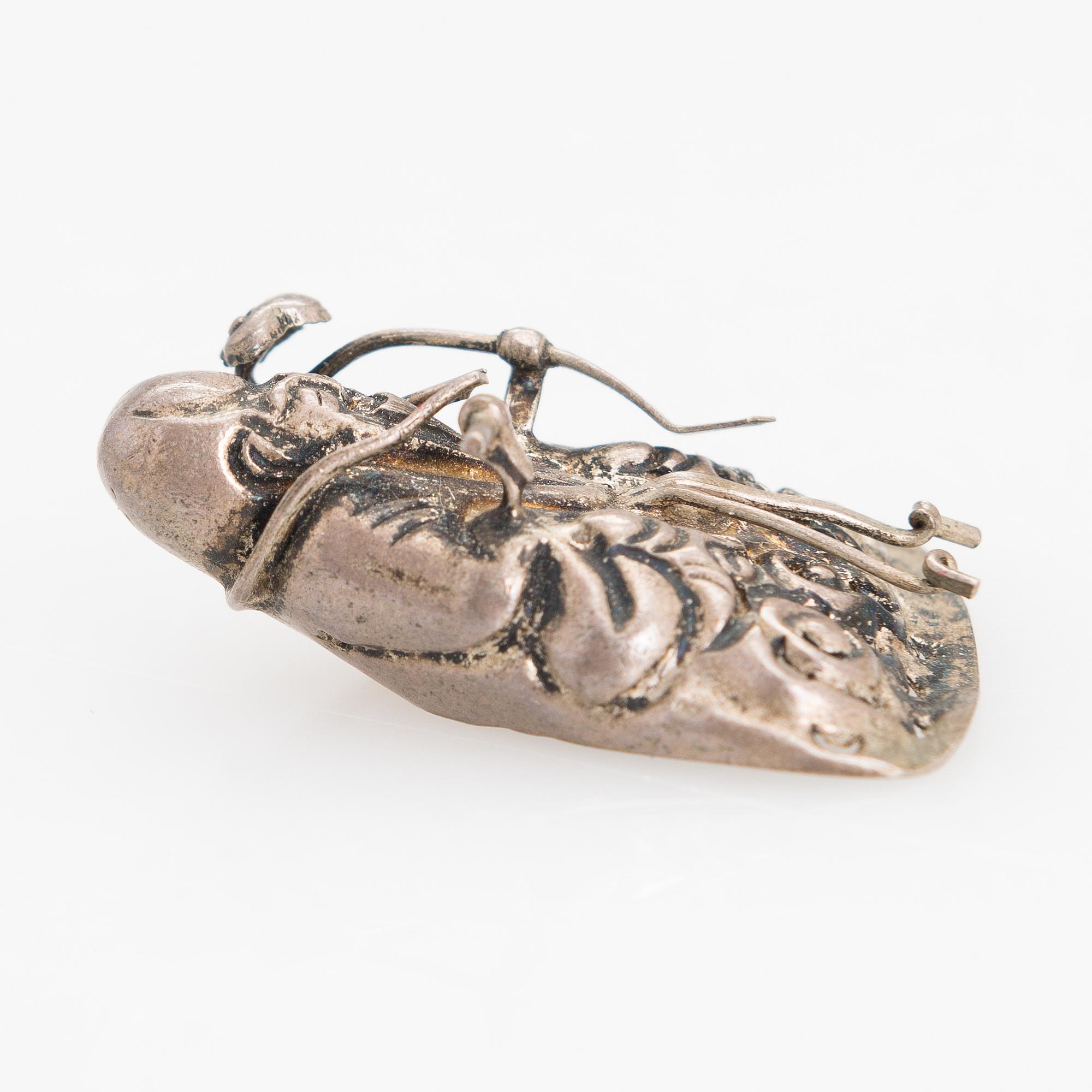 A silver figurine. China early 20th century.